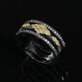 Exquisiter zweifarbiger Ring in Schwarz und Gold